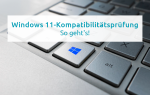 Nahaufnahme einer Laptop-Tastatur mit Windows-Logo und Text „Windows 11-Kompatibilitätsprüfung – So geht’s!“