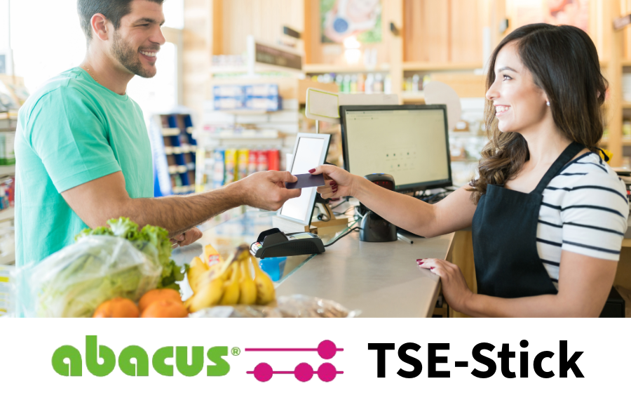 Bezahlsituation an der Kasse mit Logo von abacus
